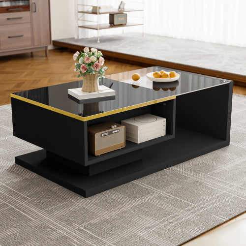 Modern black coffee table with decorative items in a living room setting