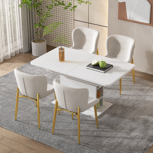 Dining room setup with a white table and chairs on a grey rug.