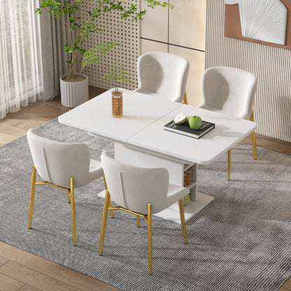 Dining room setup with a white table and chairs on a grey rug.