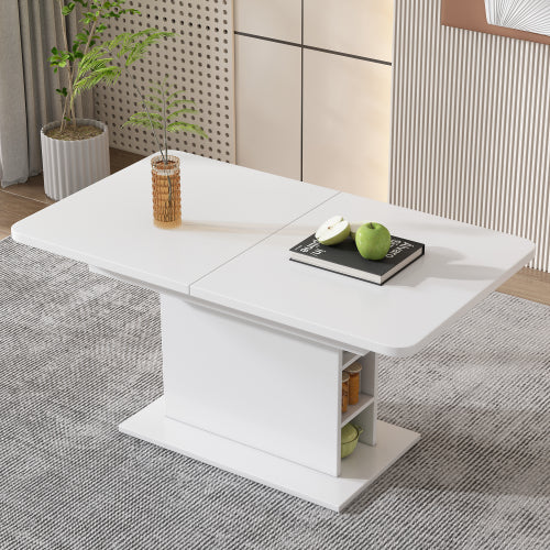 White extendable dining table with decorative items in a room setting