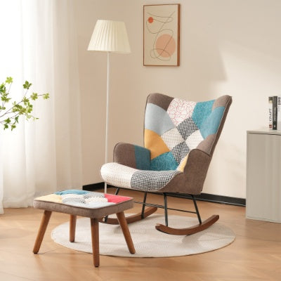Colorful patchwork rocking chair in a living room setting with a lamp and small table.
