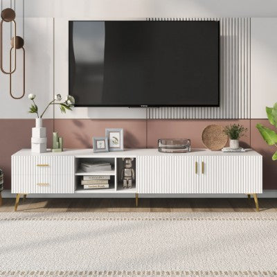 Modern living room with a white entertainment console and television.